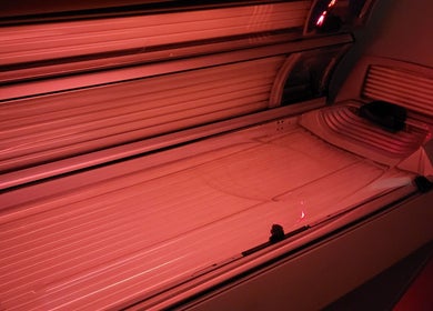 Modern tanning bed at Sunkissed Tanning & Beauty, Ballymoney, Northern Ireland, GB offering premium tanning services.