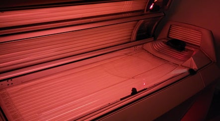 Modern tanning bed at Sunkissed Tanning & Beauty, Ballymoney, Northern Ireland, GB offering premium tanning services.