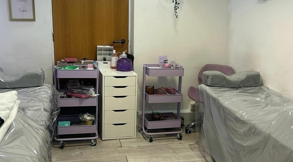 Indulge Urself's calming treatment room with beds, carts, and tools in Hatfield, England, GB.