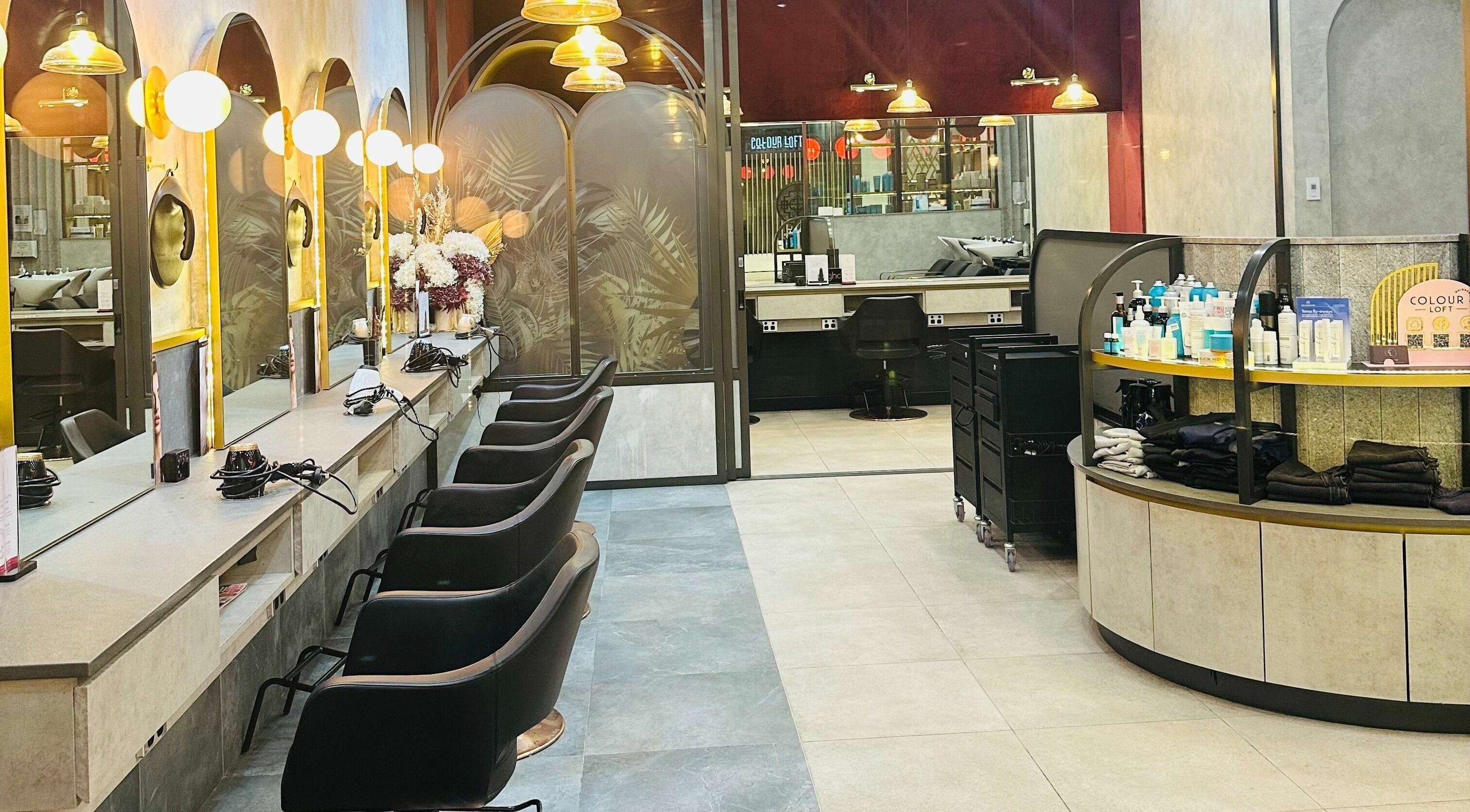 Interior of Colour Loft Hair and Beauty Edmondson Park in New South Wales, AU with stylish salon chairs.