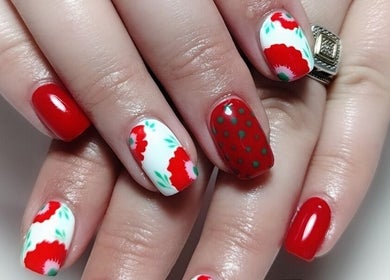 Elegant red and floral nail art at Demure Nails by Maylene, Kariega, Eastern Cape, ZA.