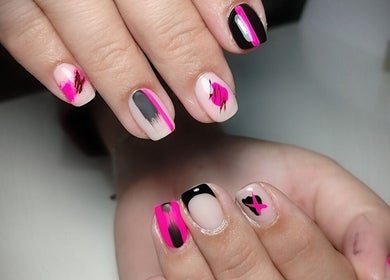 Close-up of vibrant pink and black nail art at Demure Nails by Maylene, Kariega, Eastern Cape, ZA.