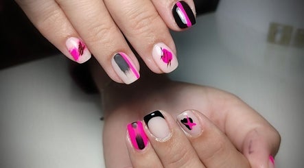 Close-up of vibrant pink and black nail art at Demure Nails by Maylene, Kariega, Eastern Cape, ZA.