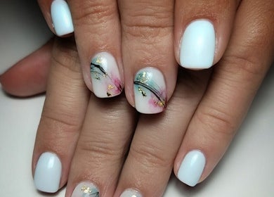 Elegant floral manicure at Demure Nails by Maylene, Kariega, Eastern Cape, ZA. Perfect for a sophisticated look.