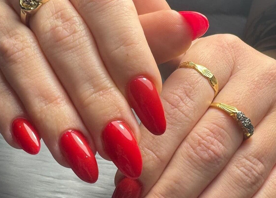 Elegant red manicured nails at KMC Nail Studio, Wanneroo, Western Australia, AU.