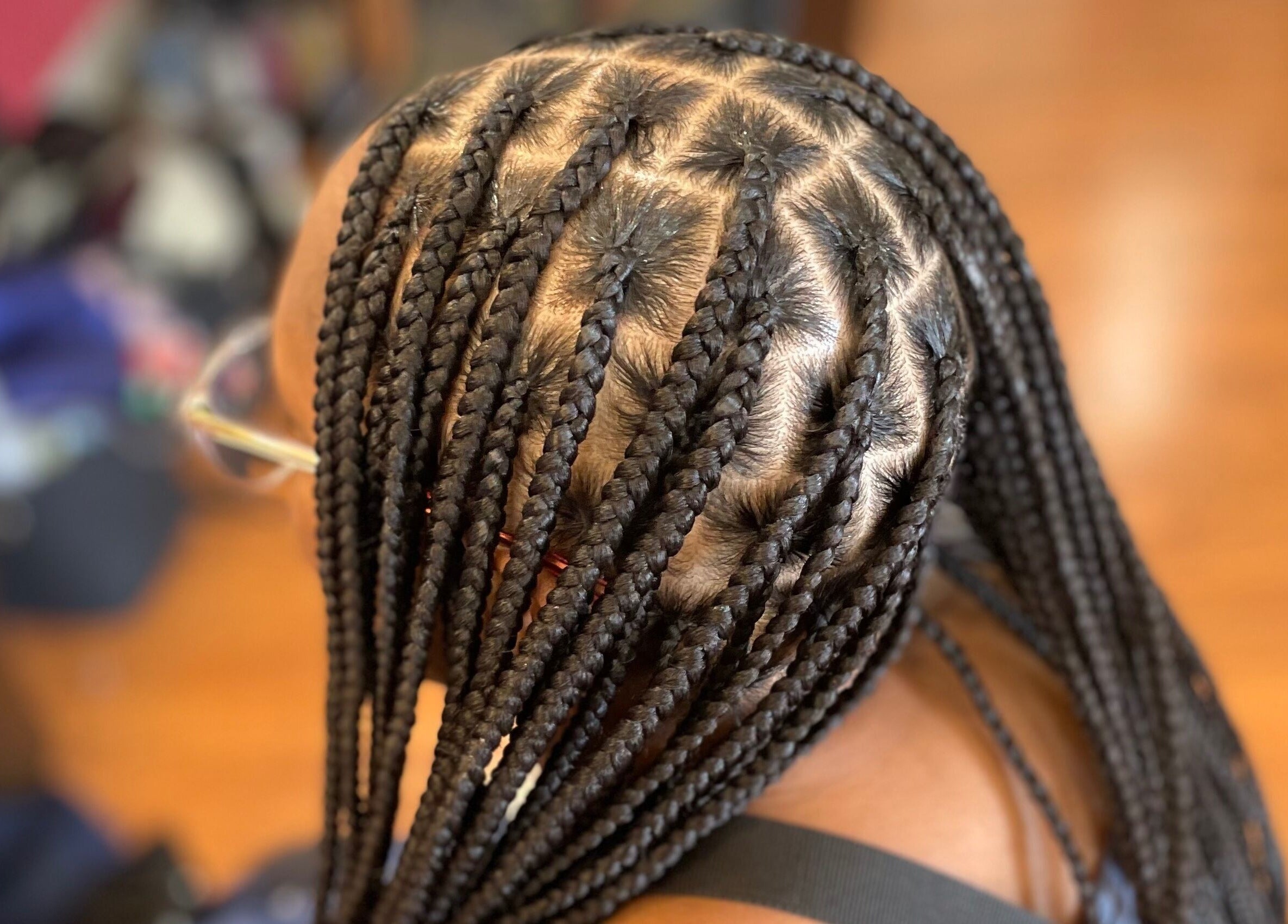 Intricate braids styled at Loc’d N Loaded in Philadelphia, Pennsylvania, US showcasing expert craftsmanship.