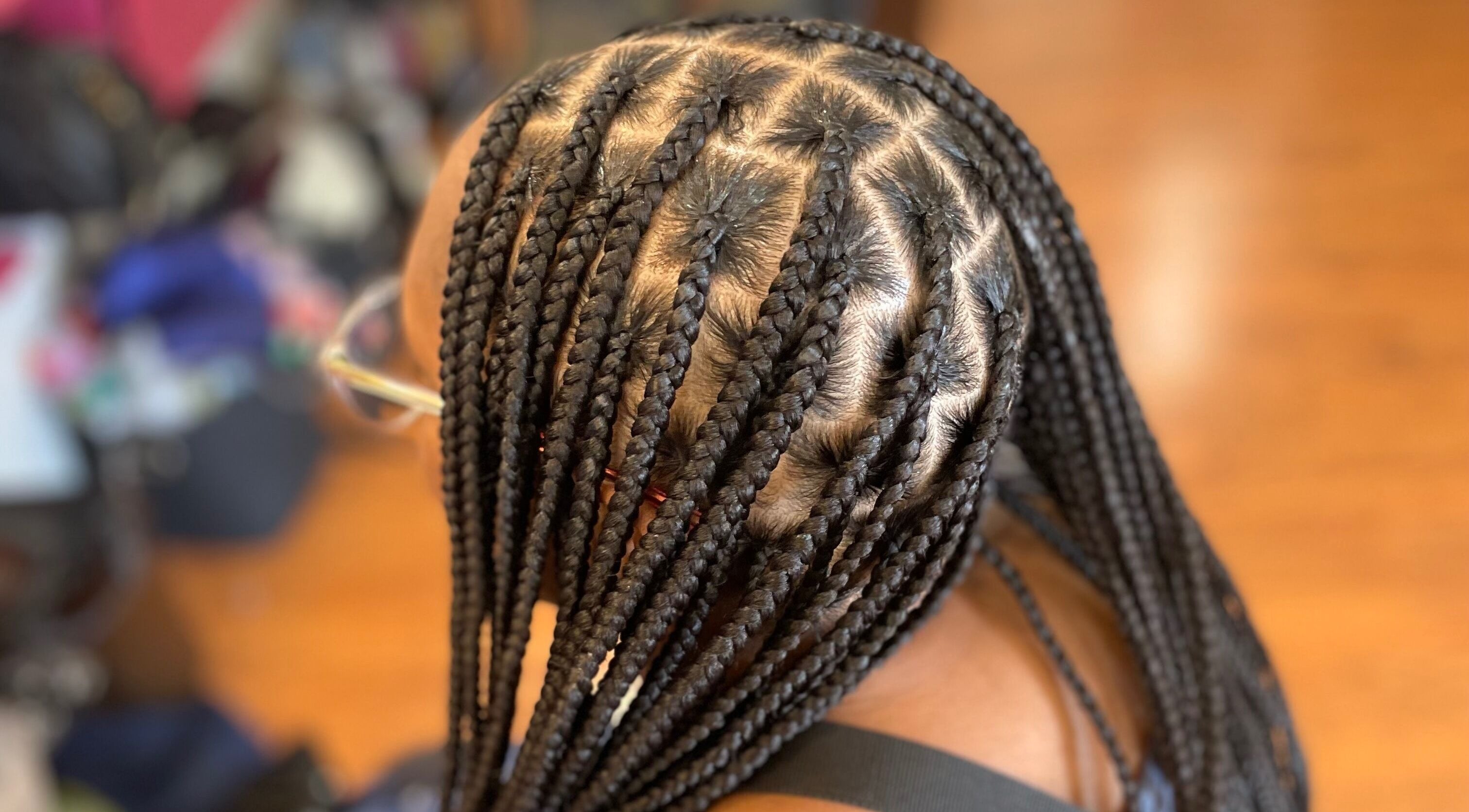 Intricate braids styled at Loc’d N Loaded in Philadelphia, Pennsylvania, US showcasing expert craftsmanship.