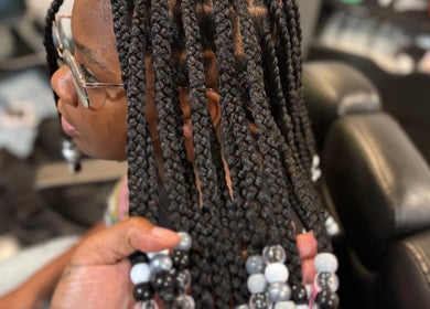 Intricate braided hairstyle at Loc’d N Loaded in Philadelphia, Pennsylvania, US.