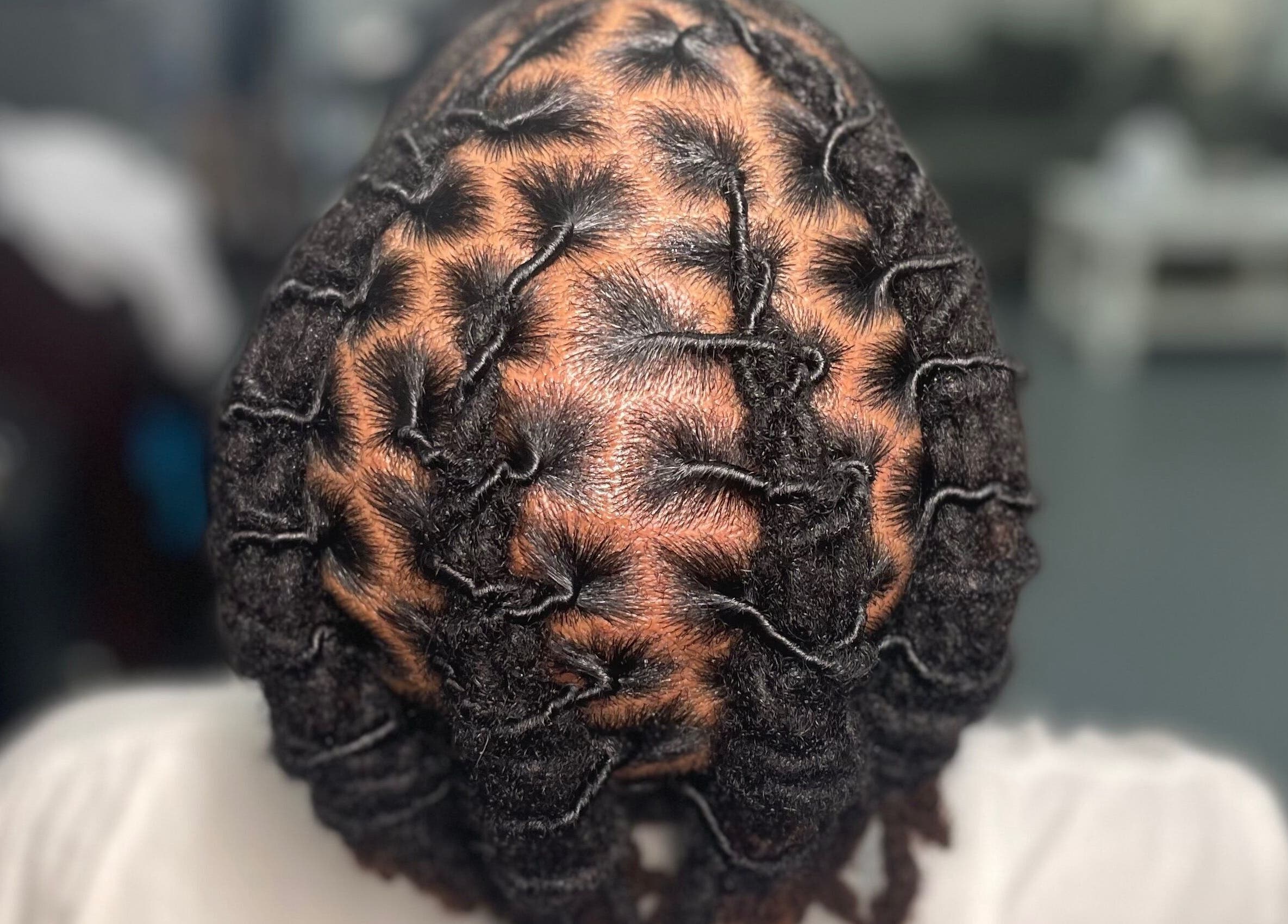 Intricate loc hairstyle showcased at Loc’d N Loaded, Philadelphia, Pennsylvania, US.