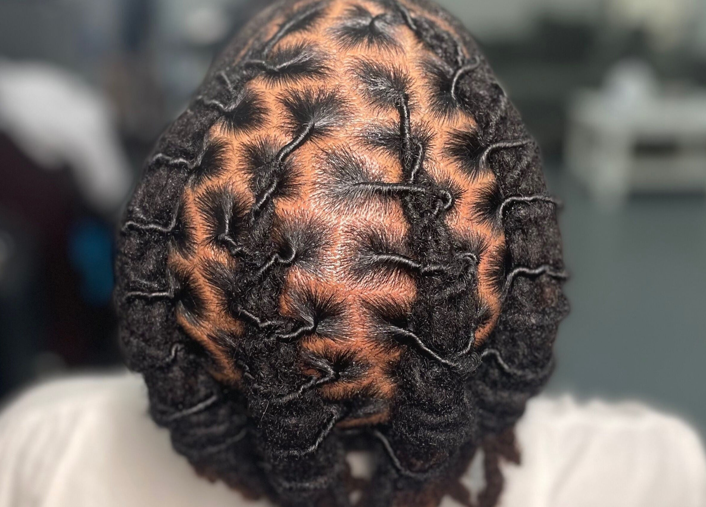 Intricate loc hairstyle showcased at Loc’d N Loaded, Philadelphia, Pennsylvania, US.