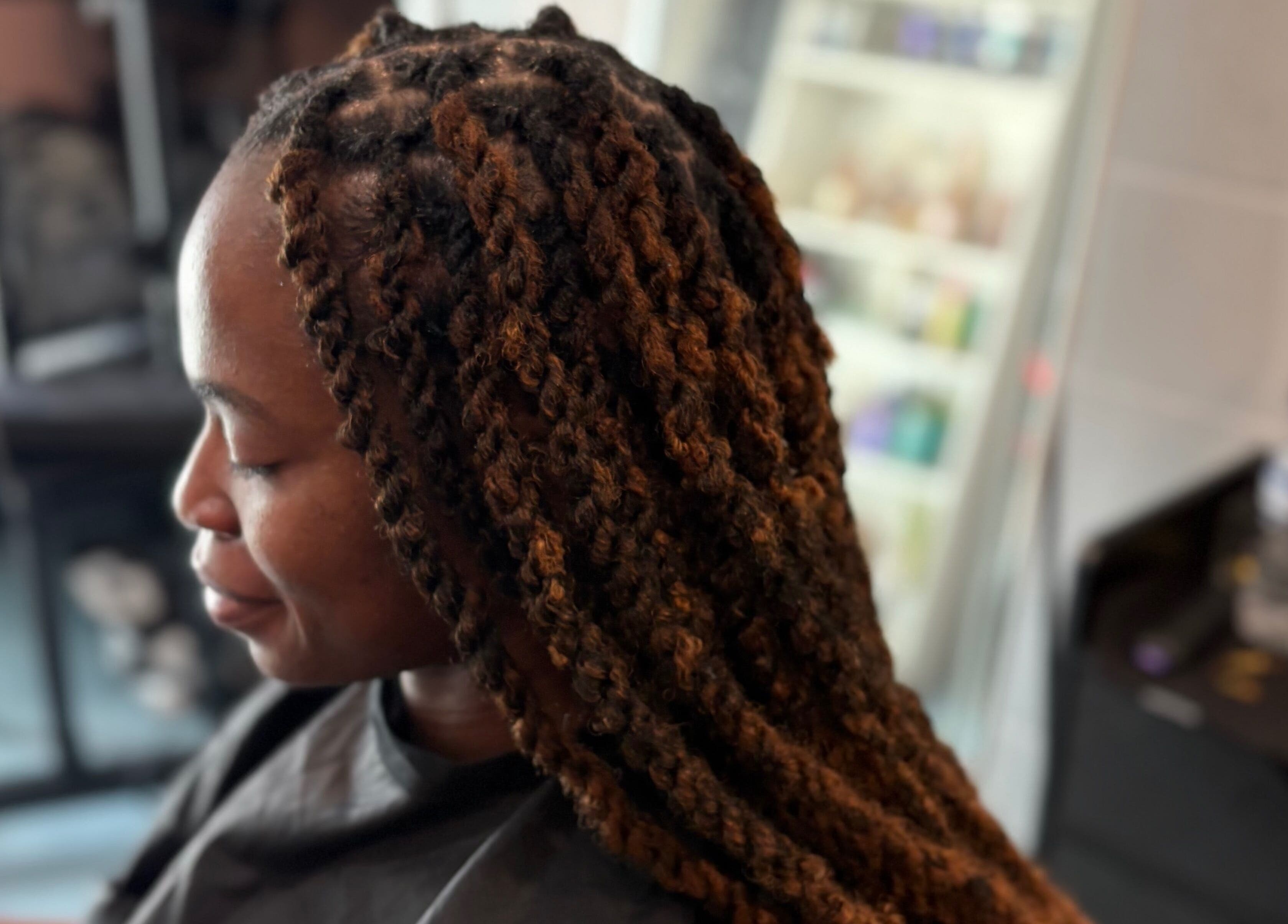 Beautifully styled locs at Loc’d N Loaded, Philadelphia, Pennsylvania, US, showcasing expert hairstyling.