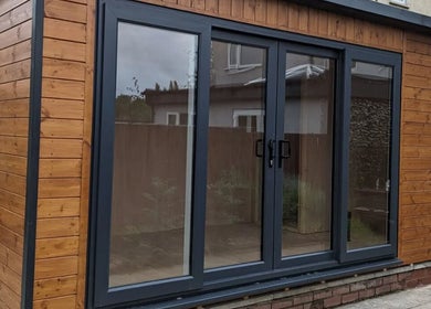 Modern wooden facade of The Hair Lounge in Halesowen, United Kingdom, GB highlighting sleek design.