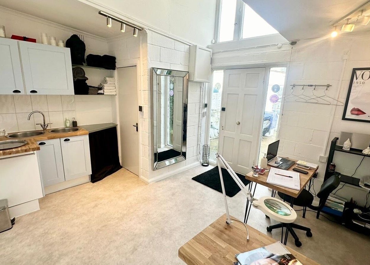 Modern interior of Facial Attraction, London, England, GB, featuring stylish decor and organized workspaces.