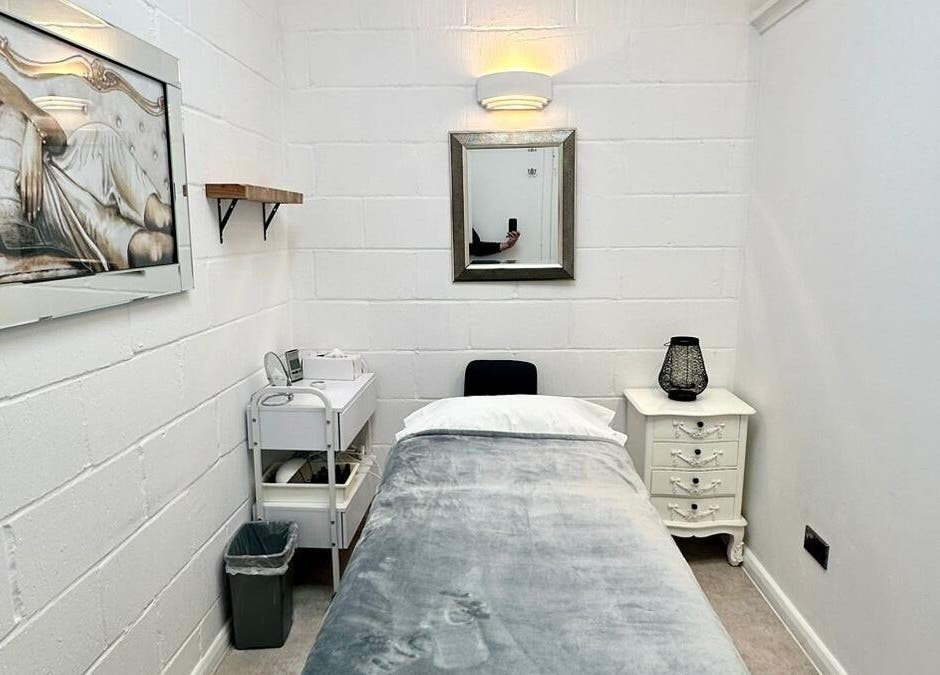 Serene spa room at Facial Attraction, London, England, GB showcasing elegant decor with massage bed.