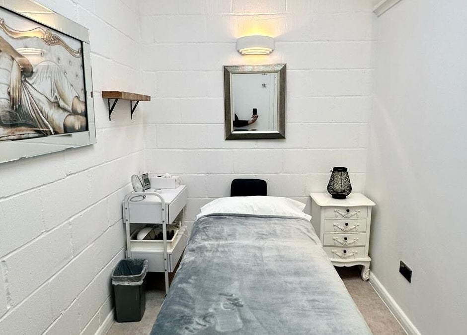 Serene spa room at Facial Attraction, London, England, GB showcasing elegant decor with massage bed.