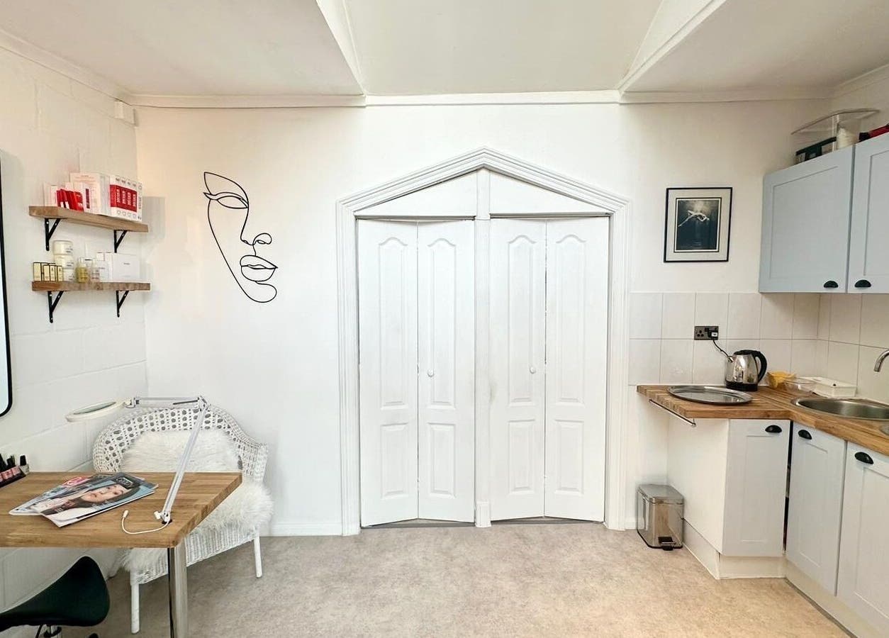 Elegant treatment room at Facial Attraction, London, England, GB, featuring serene décor and beauty essentials.