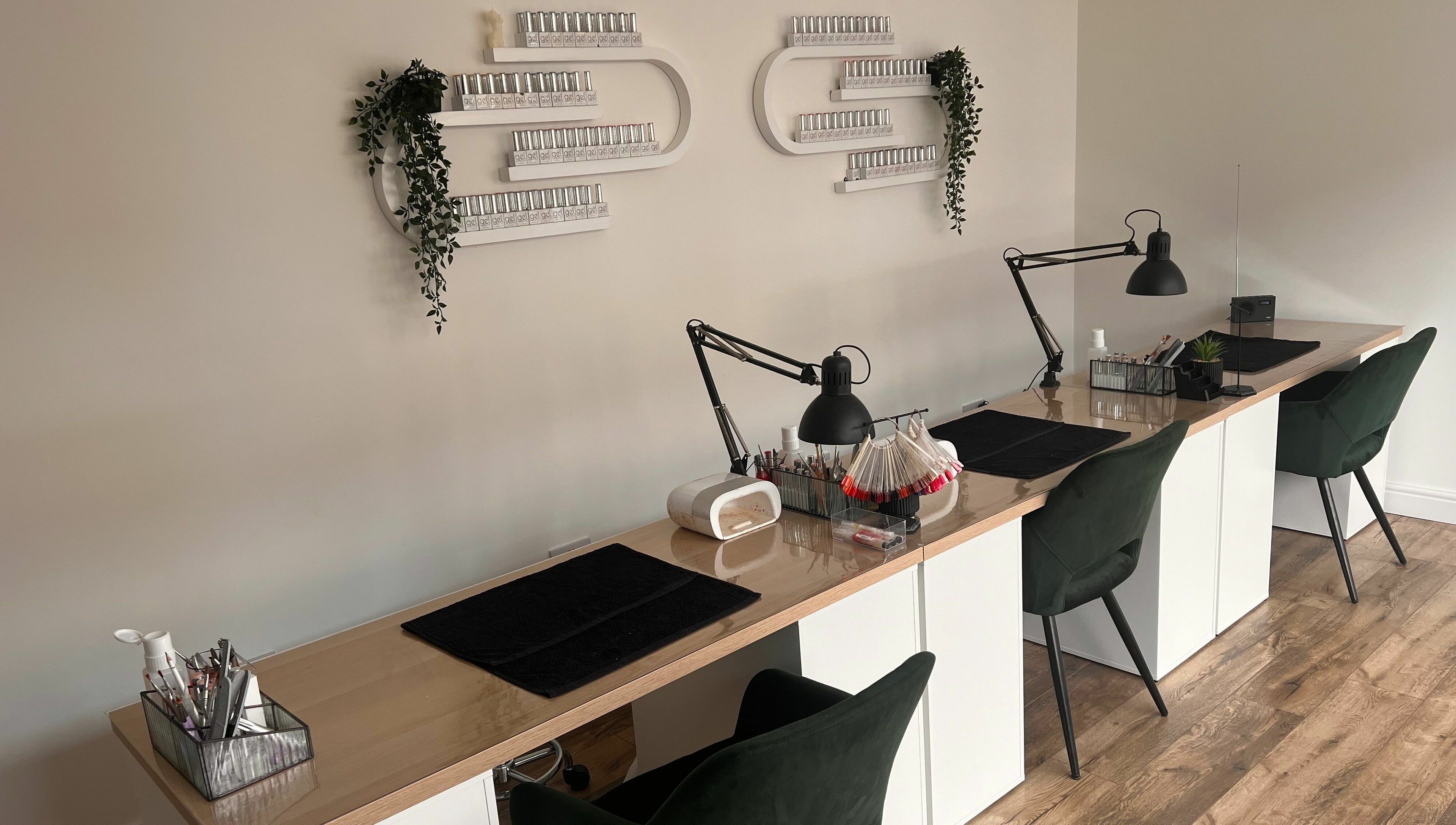 Chic nail station at The Glow Studio Beauty Salon in Neath, Wales, GB, featuring elegant decor and modern furnishings.