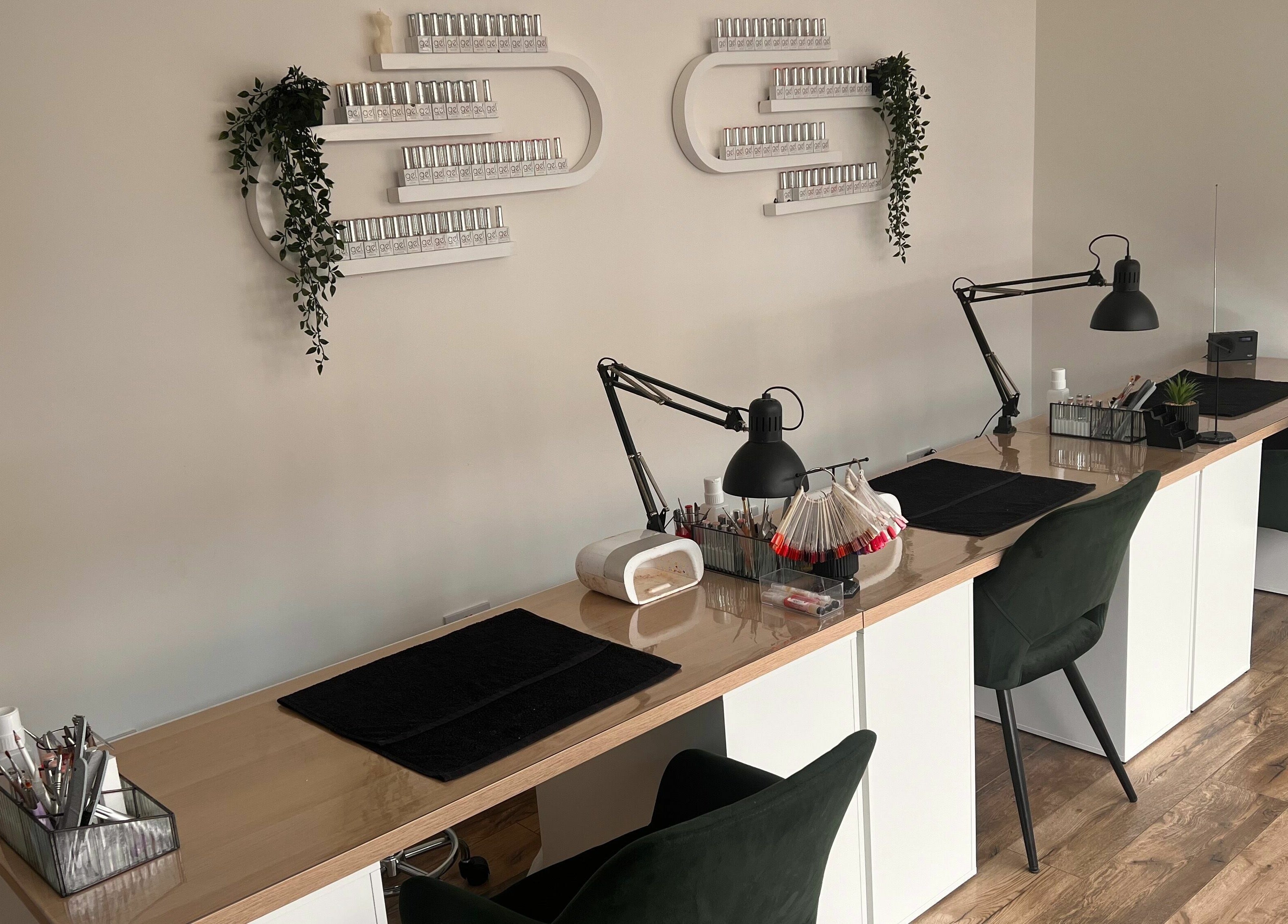 Chic nail station at The Glow Studio Beauty Salon in Neath, Wales, GB, featuring elegant decor and modern furnishings.
