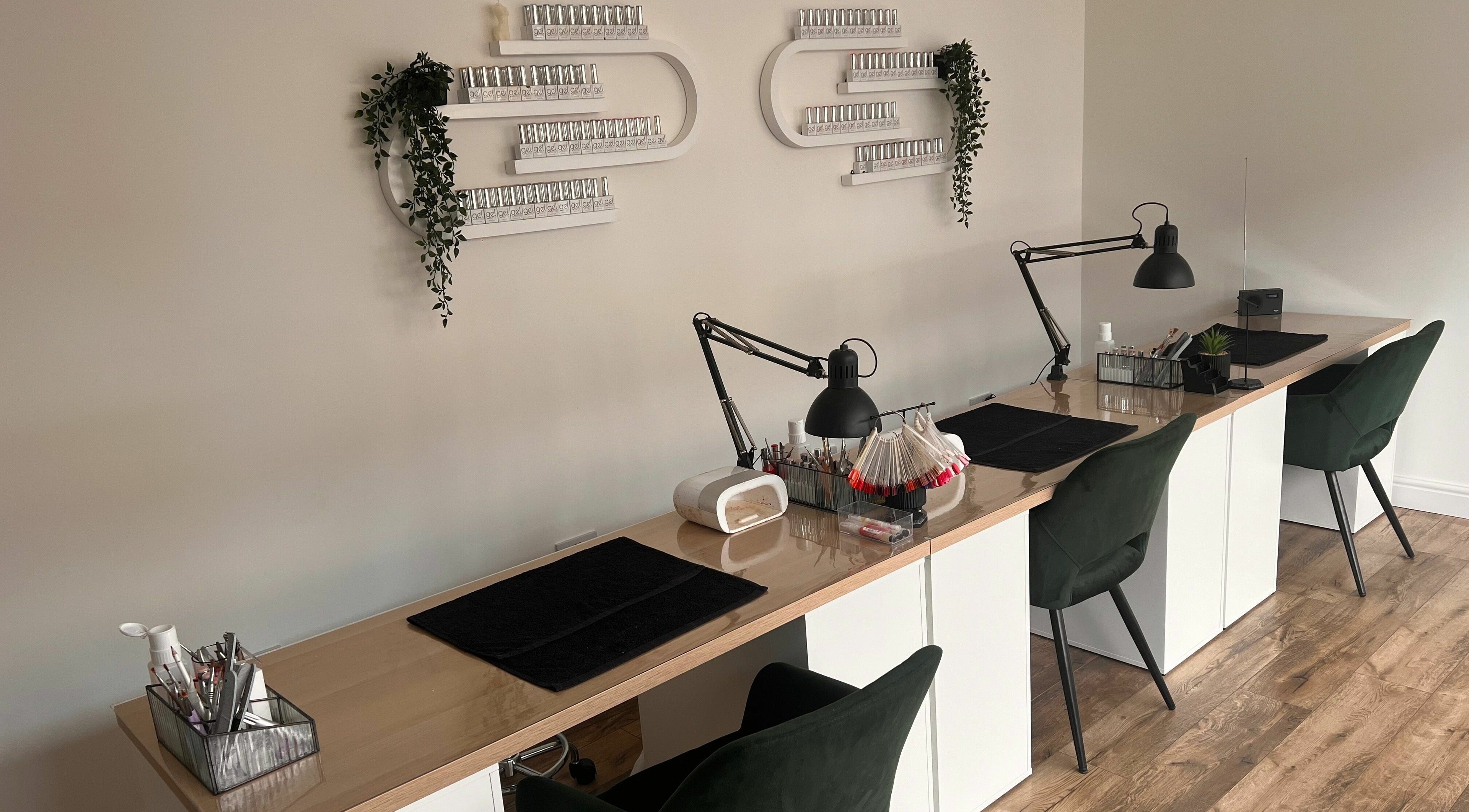 Chic nail station at The Glow Studio Beauty Salon in Neath, Wales, GB, featuring elegant decor and modern furnishings.