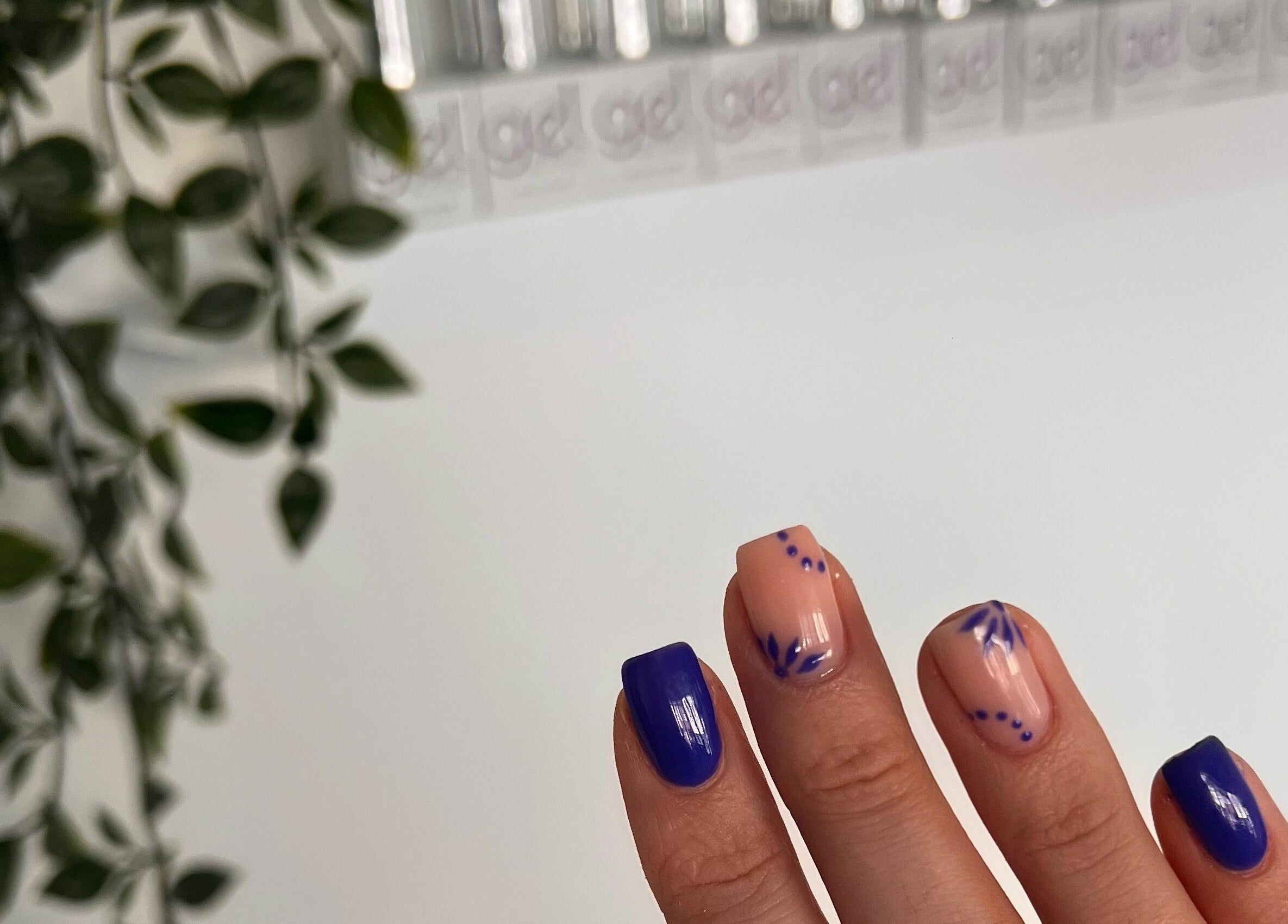 Stylish nail art with floral design at The Glow Studio Beauty Salon, Neath, Wales, GB.