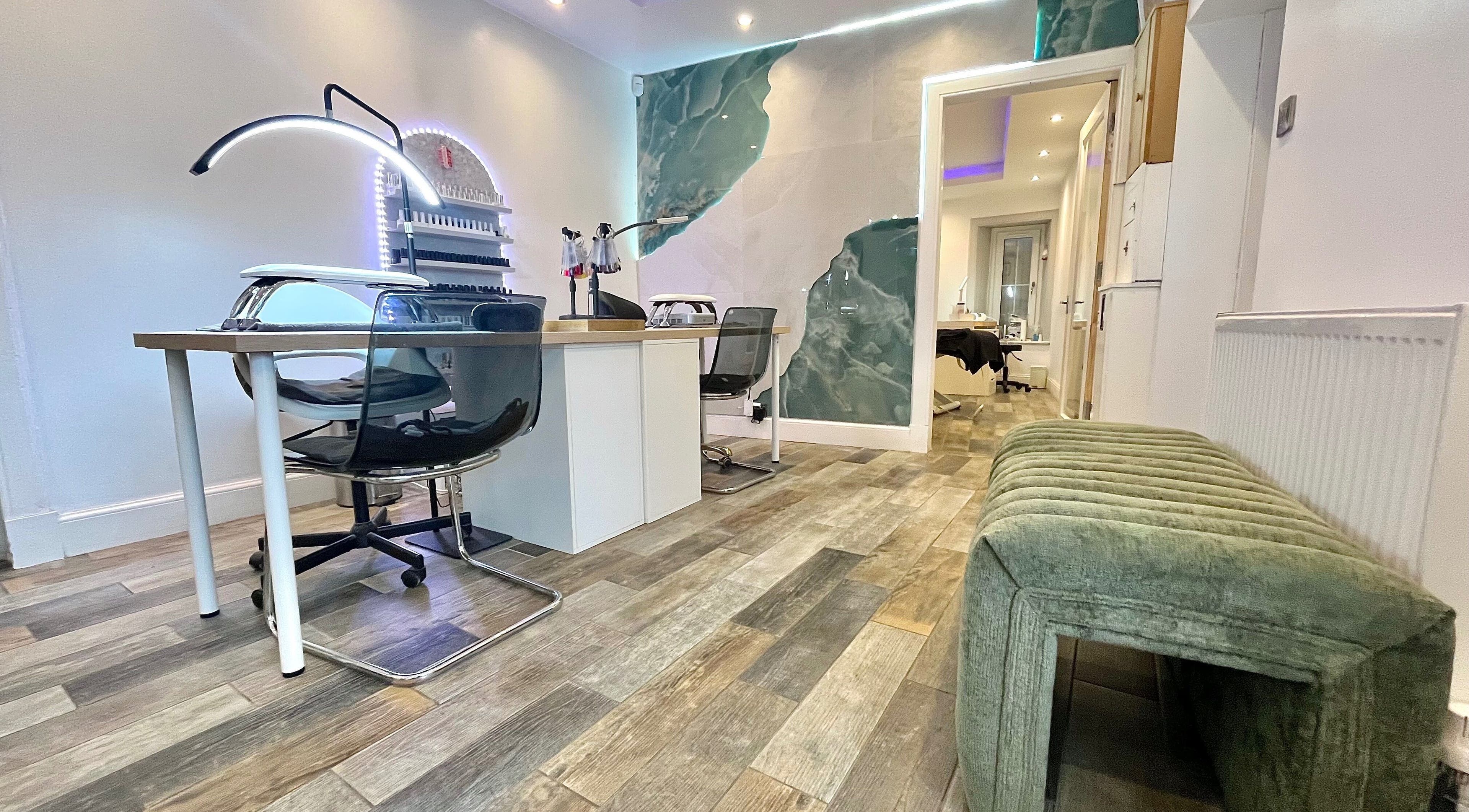 Modern nail salon area at Unique To You in Edinburgh, Scotland, GB with chic decor and ample lighting.