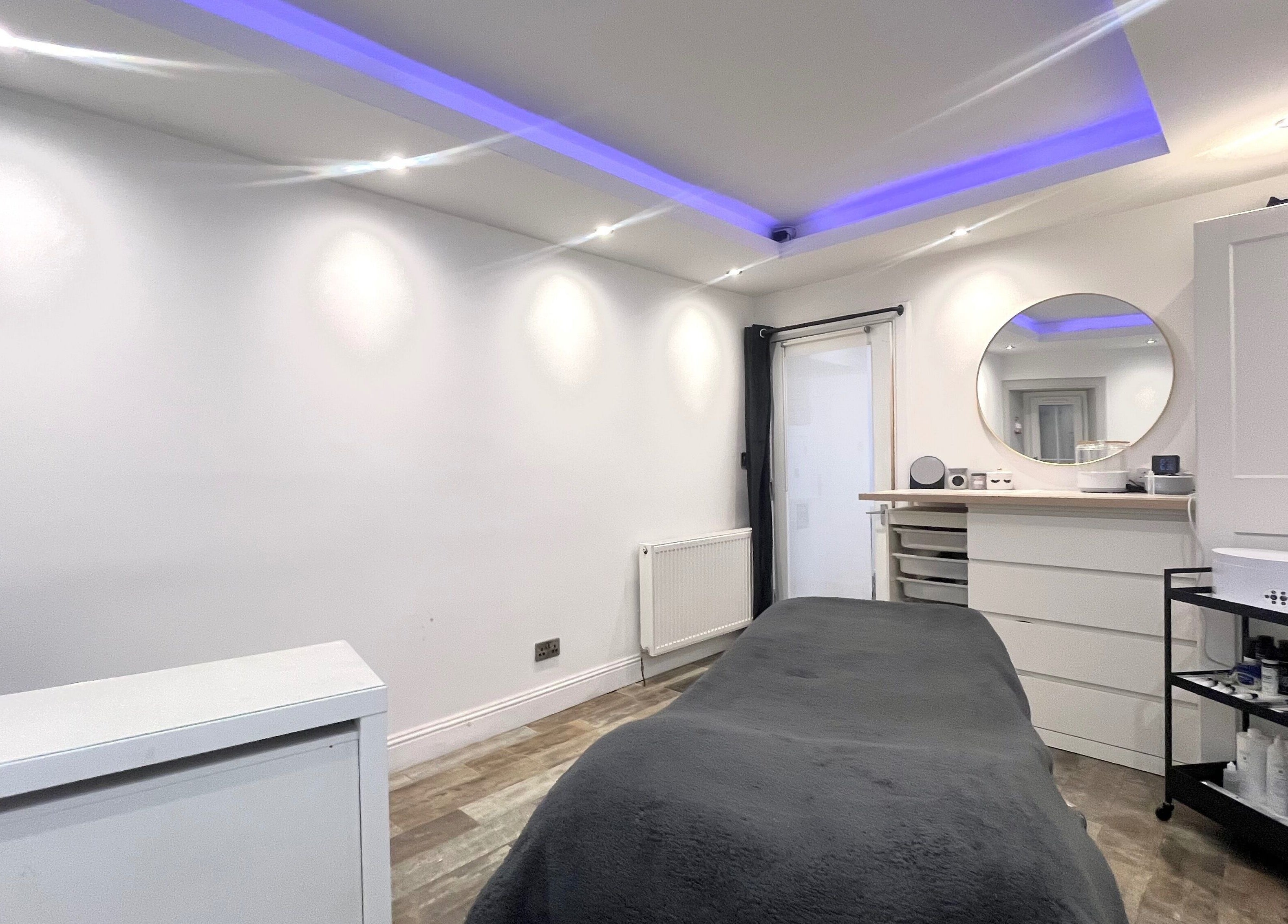 Relax in the serene treatment room at Unique To You, Edinburgh, Scotland, GB, for a personalized wellness experience.