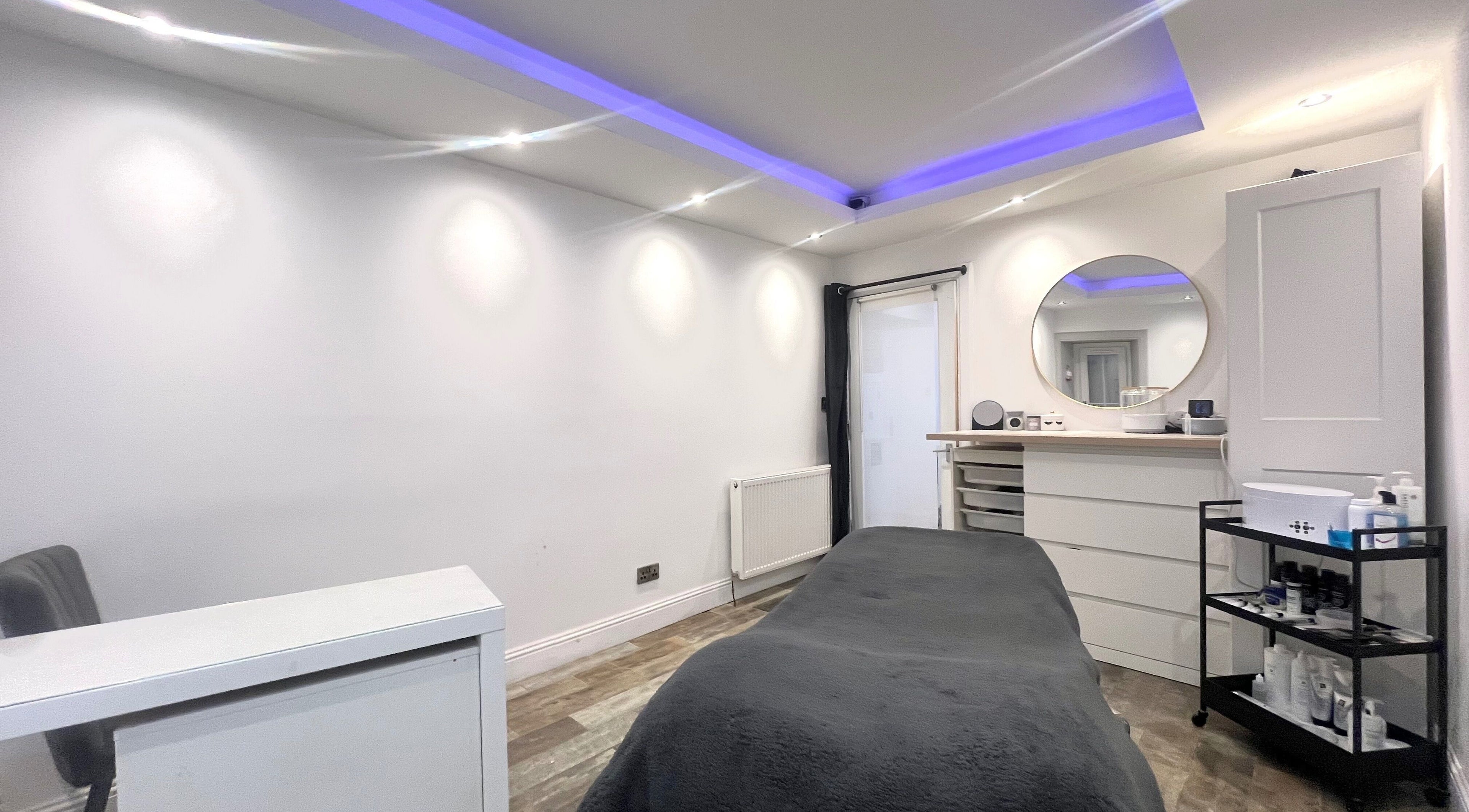 Relax in the serene treatment room at Unique To You, Edinburgh, Scotland, GB, for a personalized wellness experience.