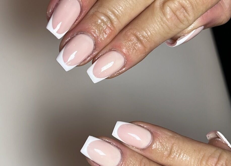 Elegant French manicure at Unique To You in Edinburgh, Scotland, GB, showcasing intricate nail art.