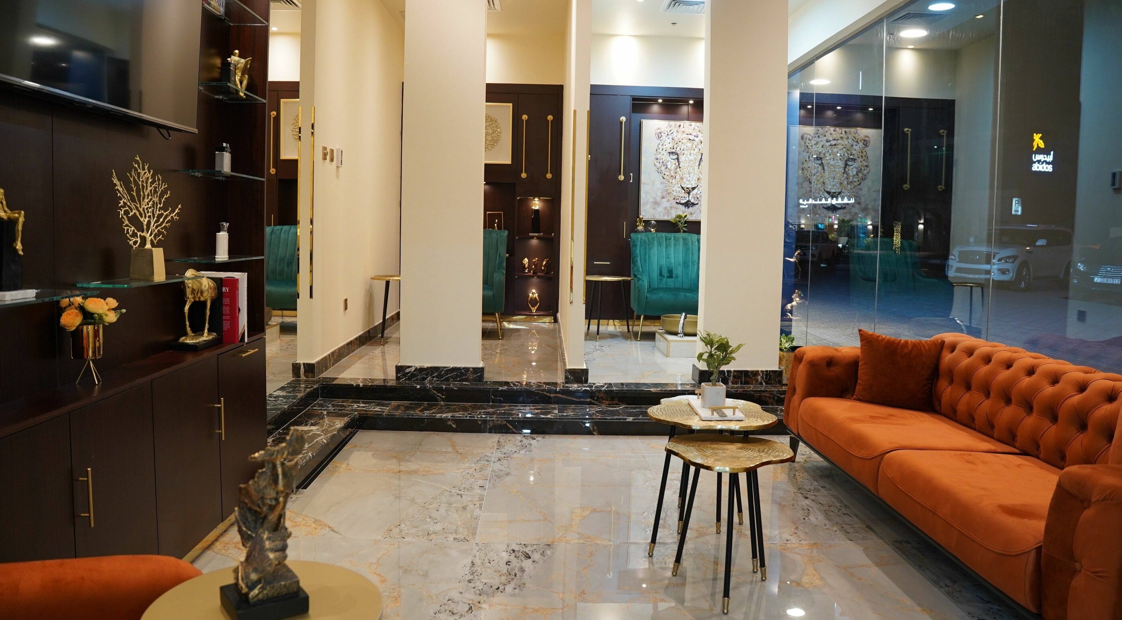 Elegant interior at Gents Mania Salon and Spa, Dubai, AE with plush seating and modern decor.