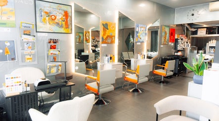 Interior of Perception London - Hair & Nail Salon in London, England, GB features modern art and sleek styling chairs.