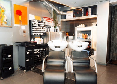 Modern wash station at Perception London - Hair & Nail Salon, London, England, GB, showcasing sleek design.