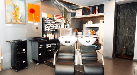 Modern wash station at Perception London - Hair & Nail Salon, London, England, GB, showcasing sleek design.