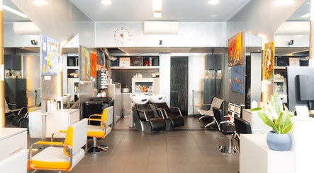 Modern interior of Perception London - Hair & Nail Salon, London, England, GB with stylish chairs and art.