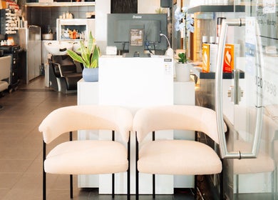 Stylish entrance at Perception London - Hair & Nail Salon, London, England, GB. Inviting interior design with chairs.
