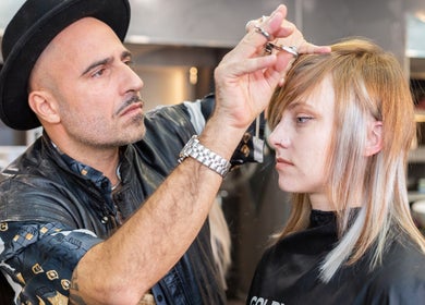 Stylist crafting a modern haircut at Perception London - Hair & Nail Salon, London, England, GB.