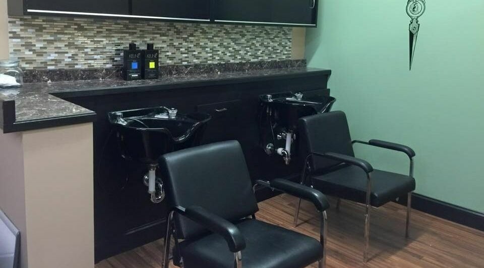 Chic wash area at Salon2000, Tyngsborough, Massachusetts, US with sleek chairs and modern design.