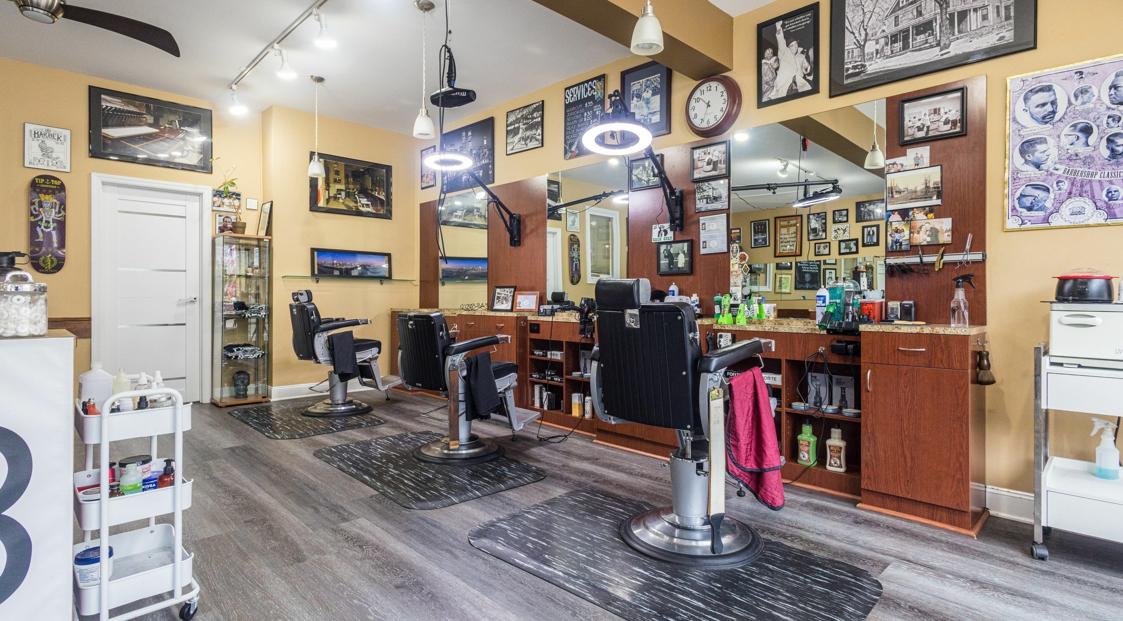 Interior of Empire State Barbershop in Tappan, New York, US with vintage decor and modern barber chairs.