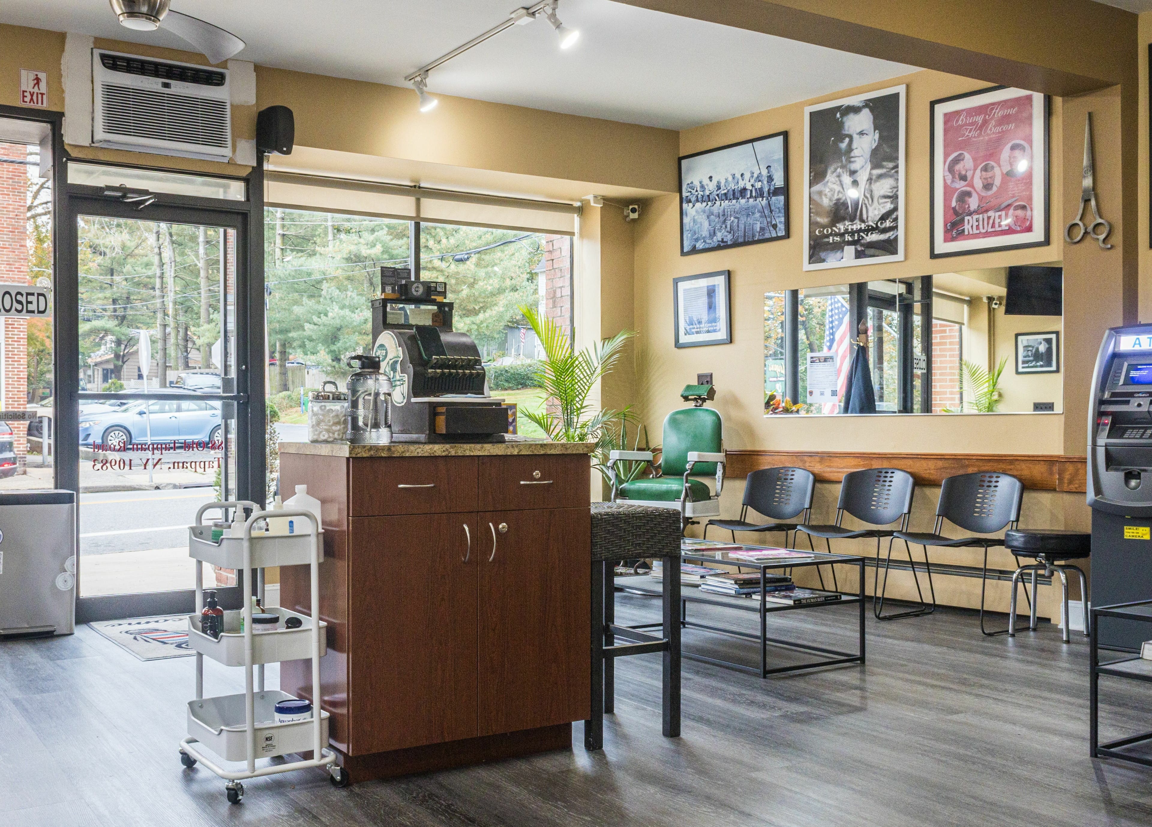 Inside of Empire State Barbershop in Tappan, New York, US with vintage decor and welcoming seating.