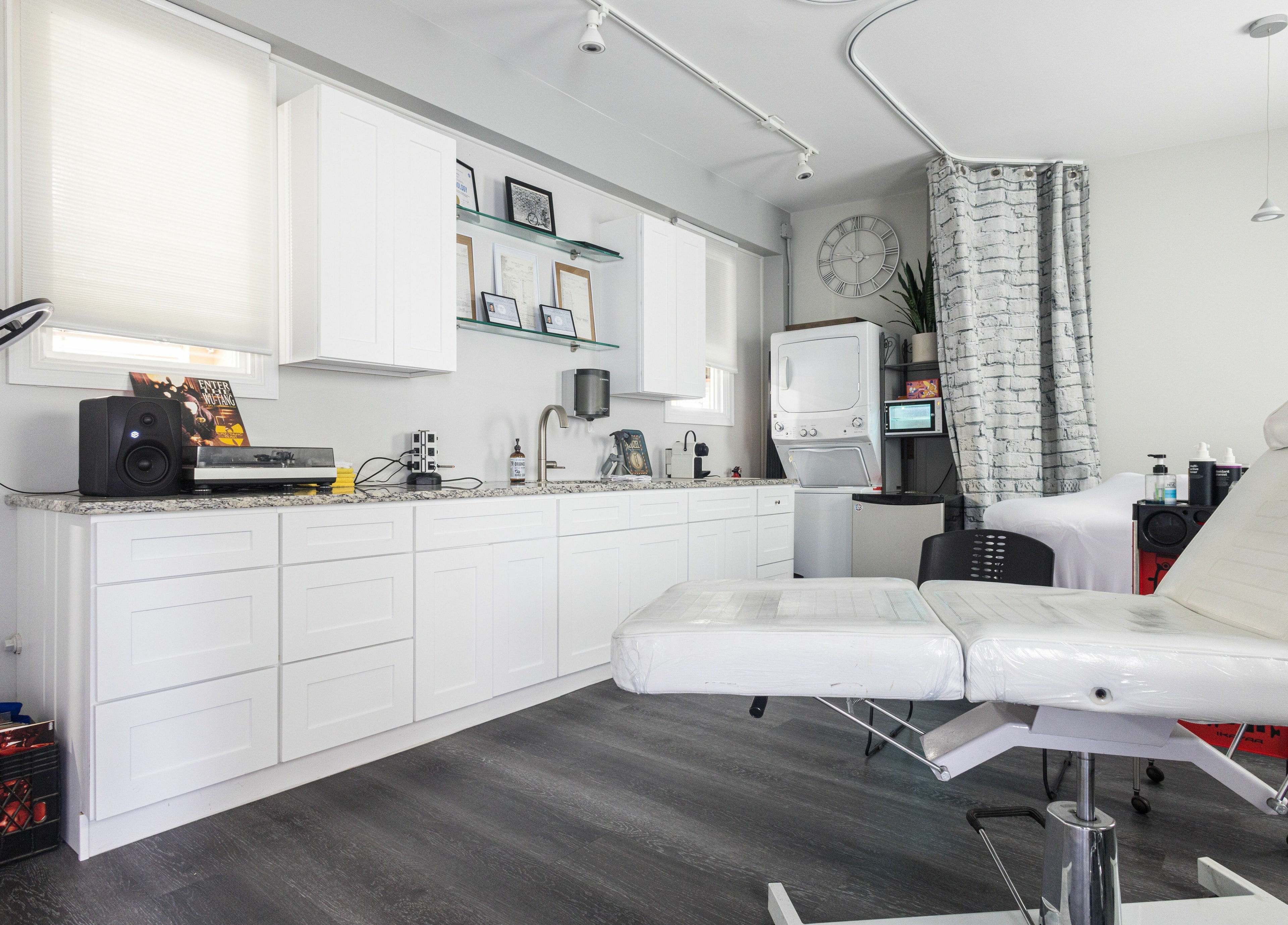 Modern interior of Empire State Barbershop in Tappan, New York, US featuring stylish treatment area.