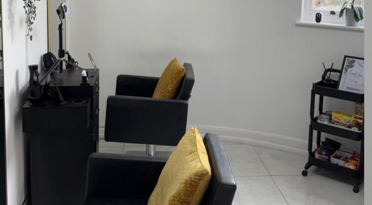 Modern salon chairs at Venture Hair & Beauty, Chelmsford, England, GB. Sleek and welcoming interior design.