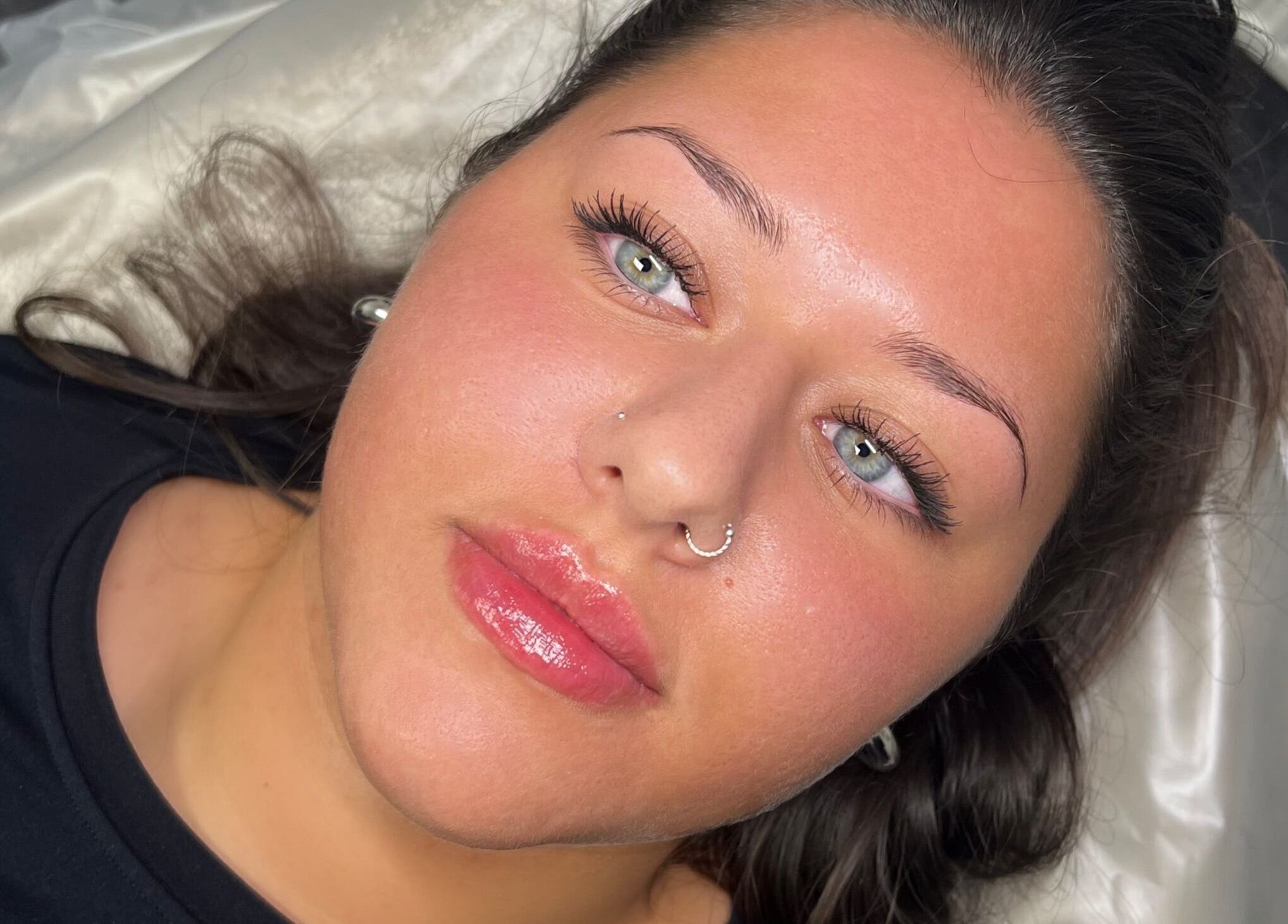 Close-up of a woman with glowing skin after a beauty treatment at The Beauty Clinic, Bedford, England, GB.