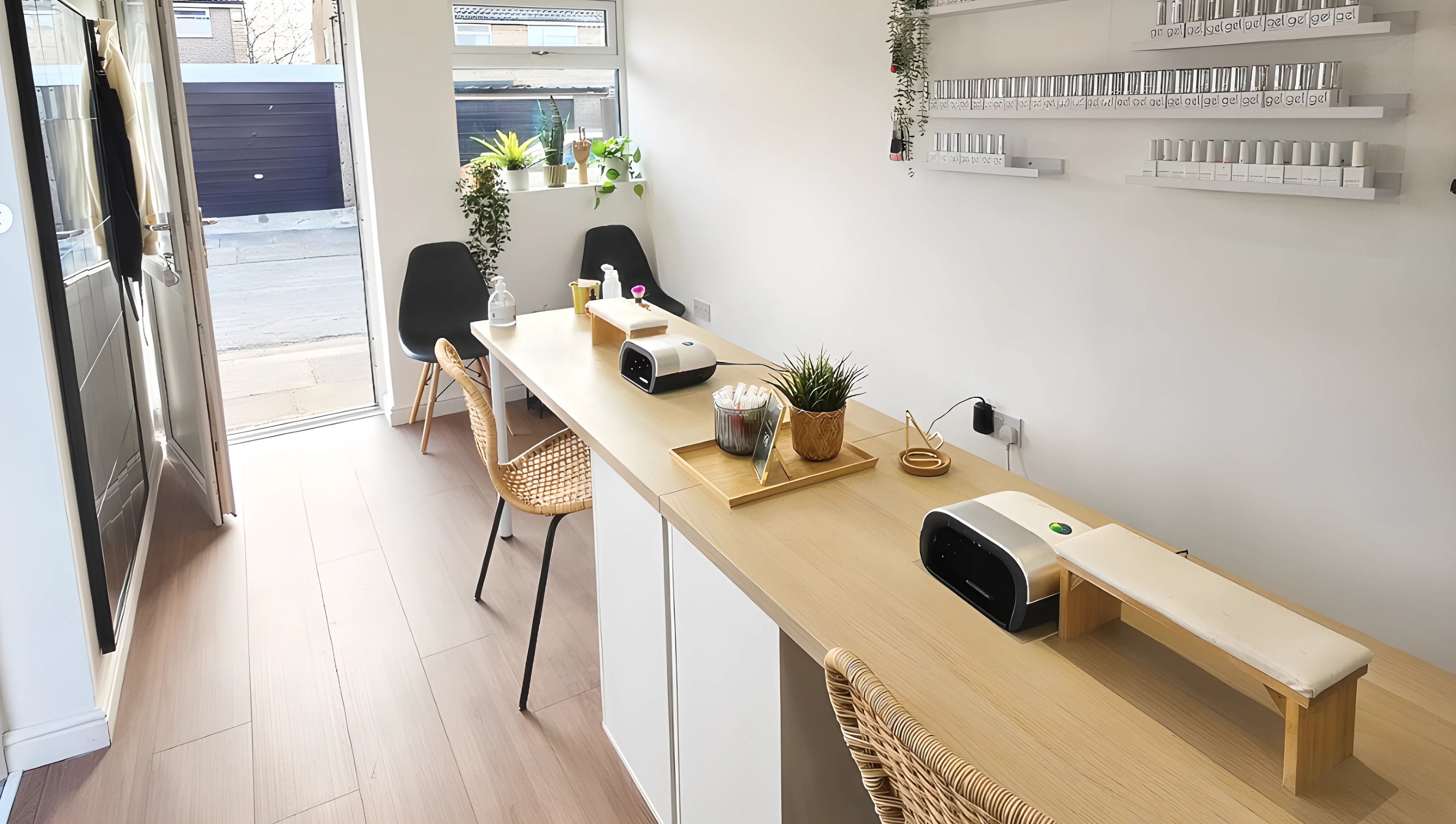 Modern nail station at Babe Cave, Birkenhead, England, GB, with chic seating and nail polish displays.