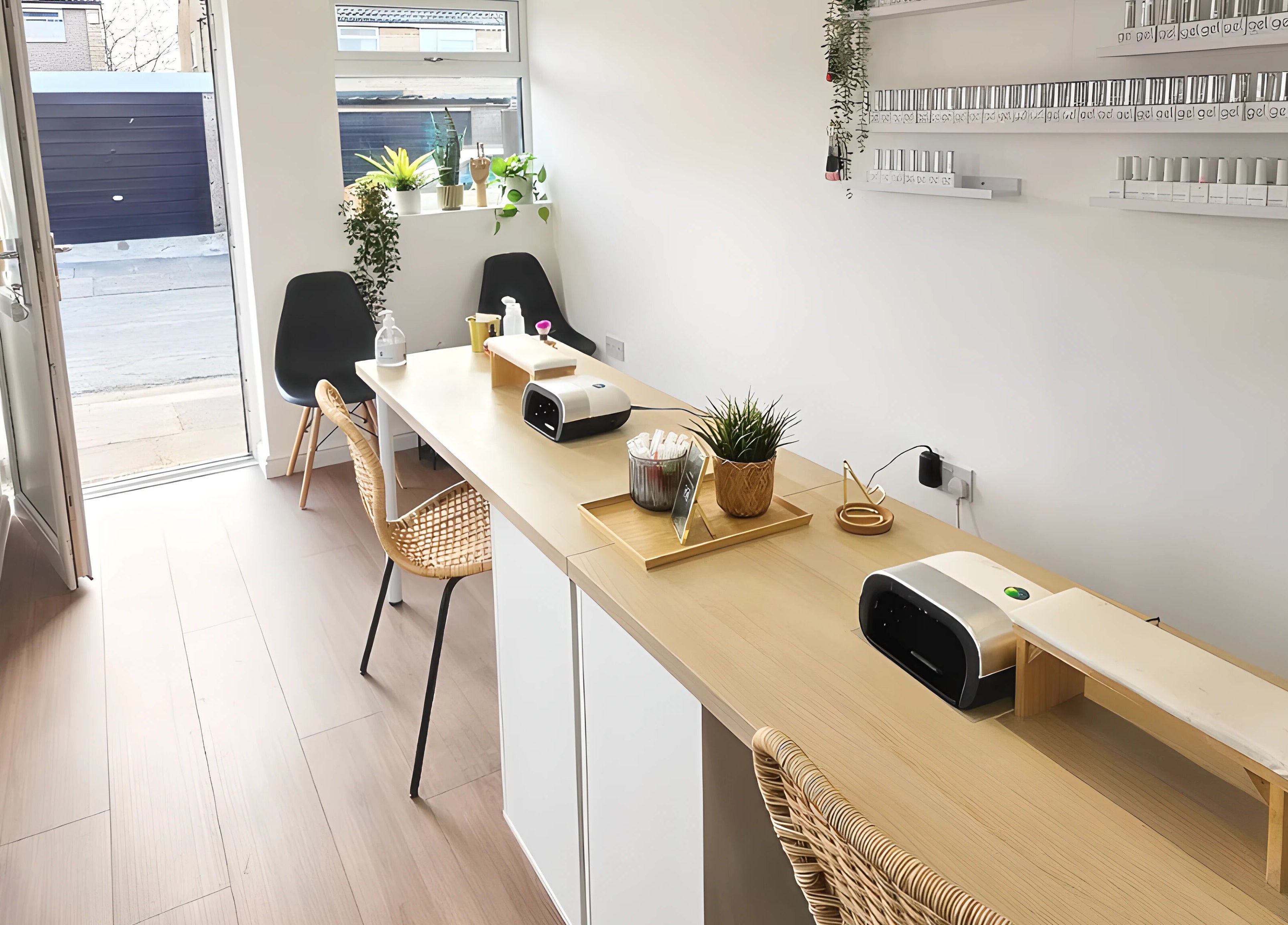 Modern nail station at Babe Cave, Birkenhead, England, GB, with chic seating and nail polish displays.