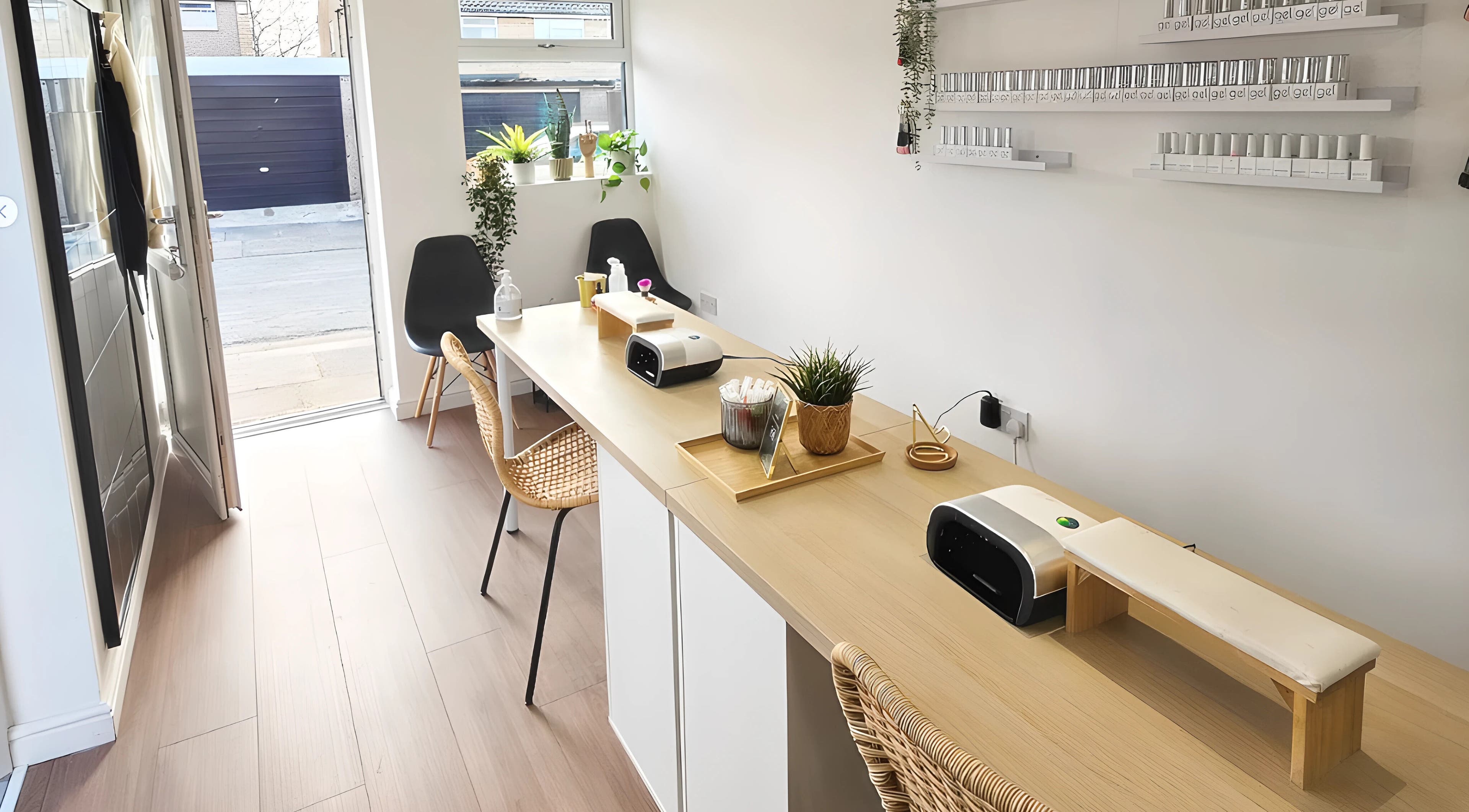 Modern nail station at Babe Cave, Birkenhead, England, GB, with chic seating and nail polish displays.