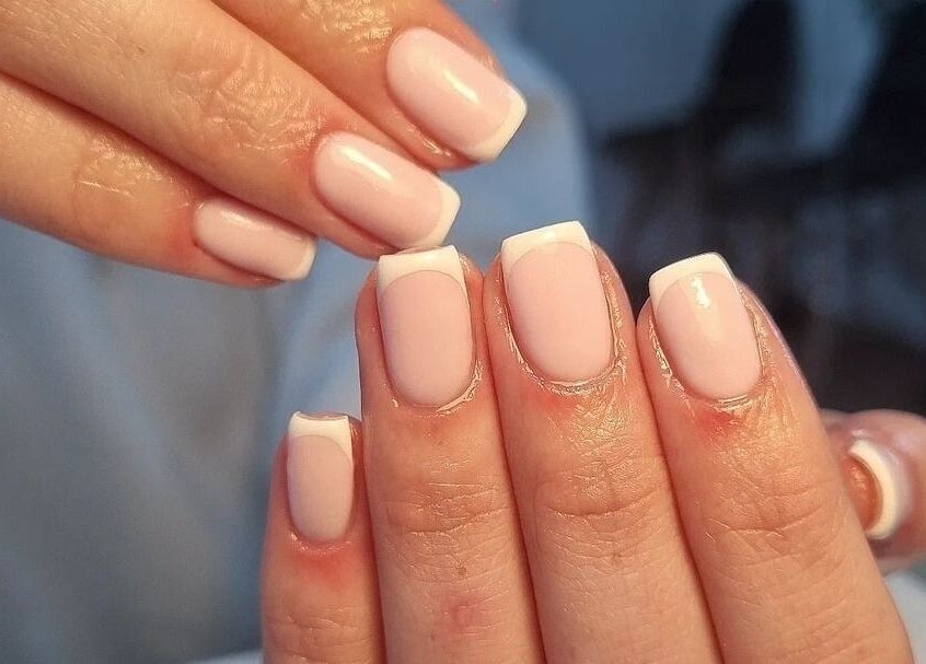 Elegant French manicure at Babe Cave, Birkenhead, England, GB showcasing perfect nail art.