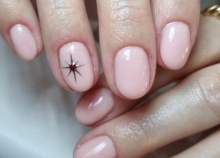 Close-up of elegant starry nail art at Babe Cave, Birkenhead, England, GB offering exquisite manicures.