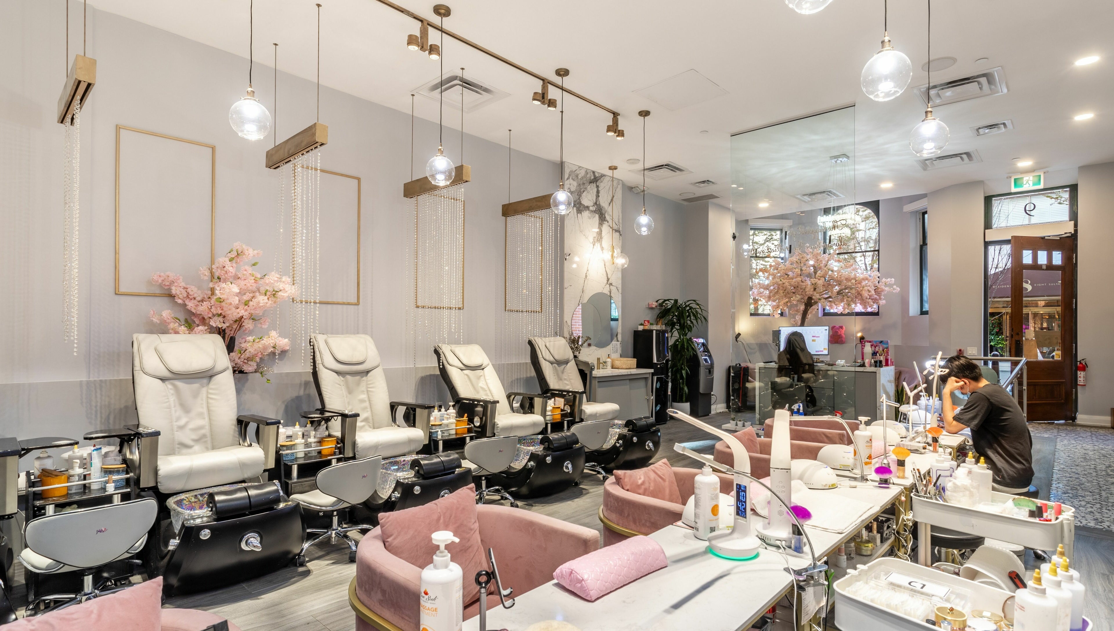 Relaxing interior of Tokyo Nails and Spa in Toronto, Ontario, CA featuring plush chairs and elegant decor.