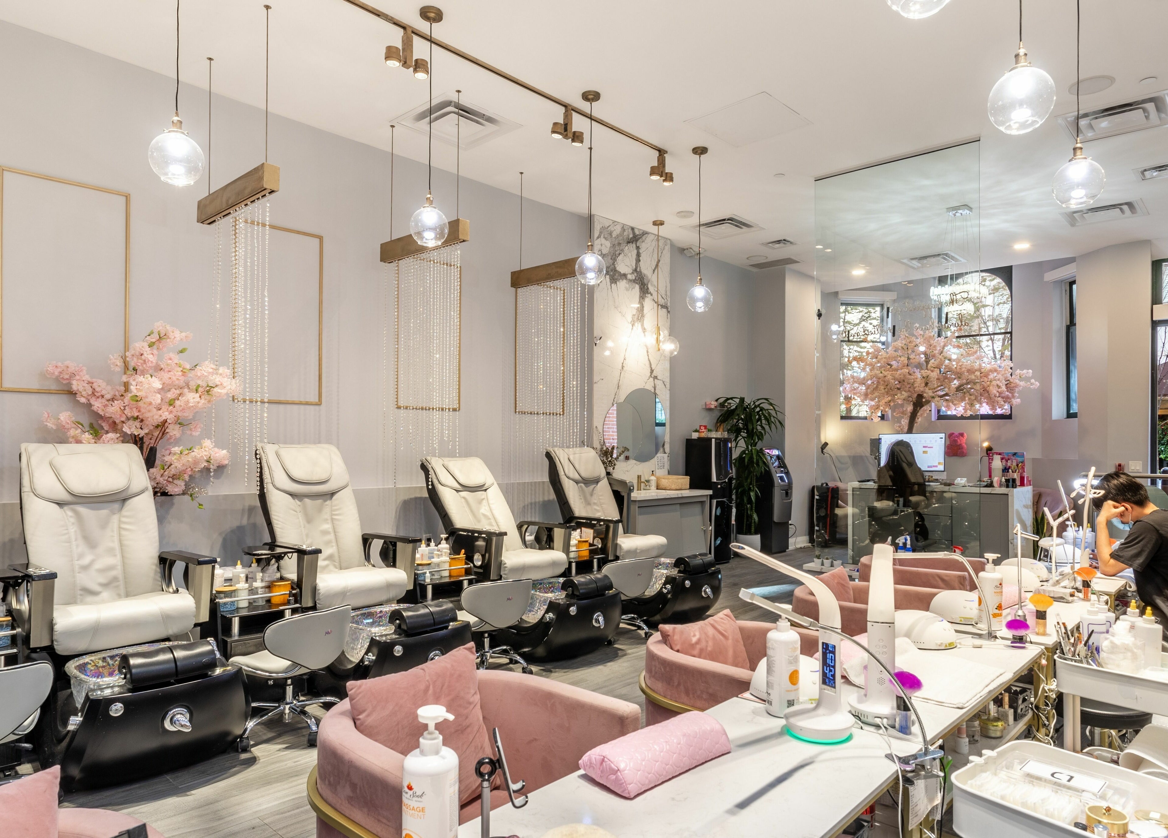 Relaxing interior of Tokyo Nails and Spa in Toronto, Ontario, CA featuring plush chairs and elegant decor.