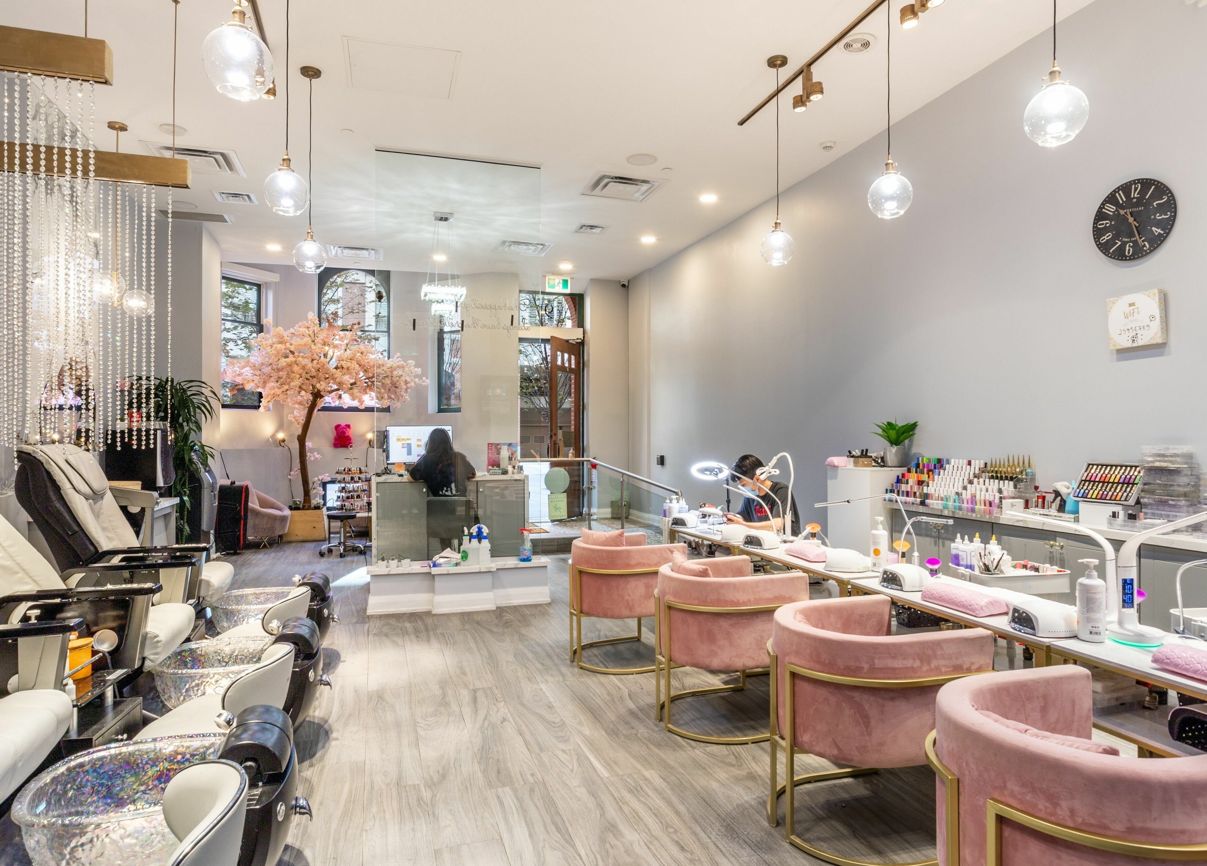Elegant interior of Tokyo Nails and Spa in Toronto, Ontario, CA, featuring plush seating and modern decor.
