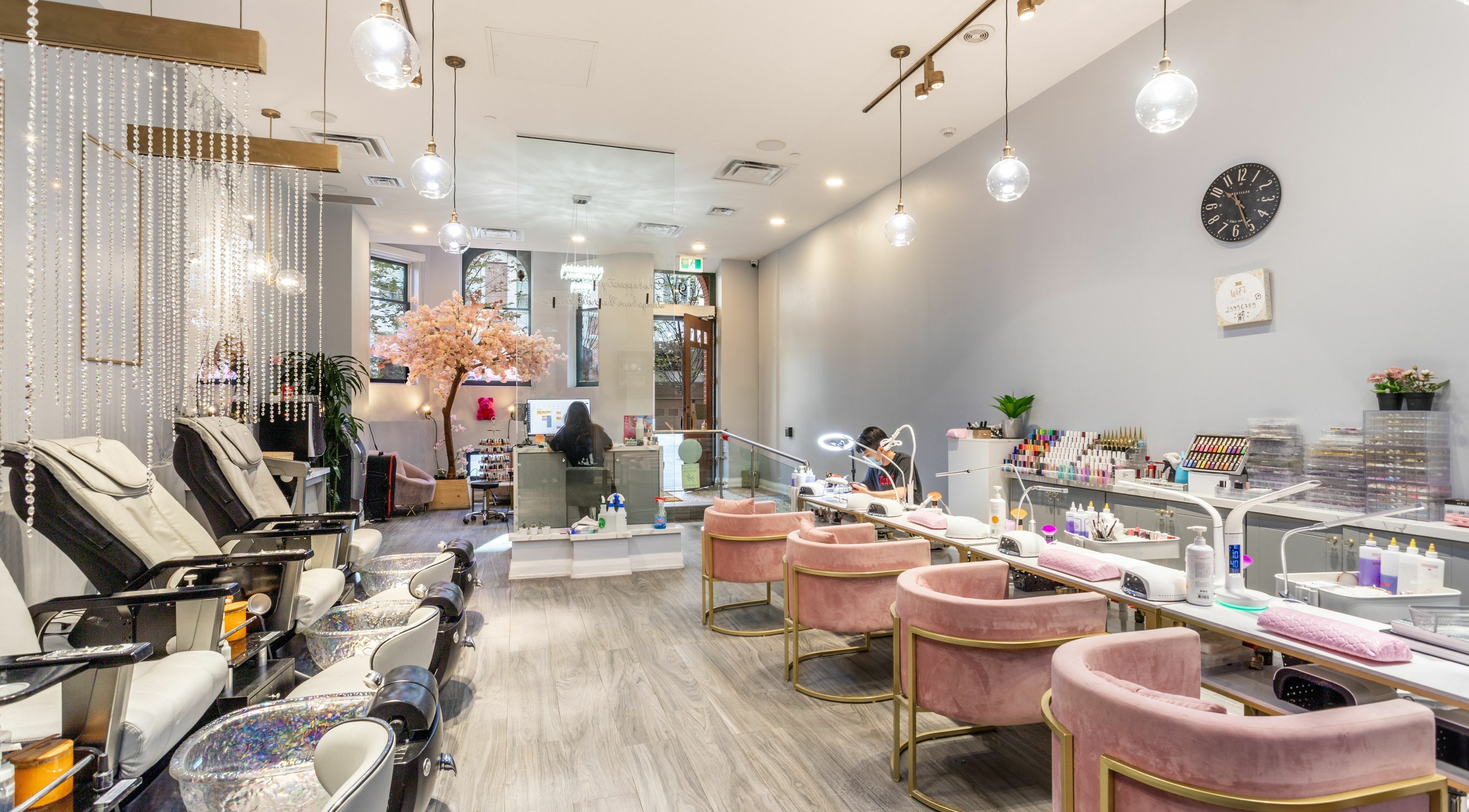 Elegant interior of Tokyo Nails and Spa in Toronto, Ontario, CA, featuring plush seating and modern decor.